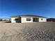 Spacious backyard featuring a newly built home with large windows and modern design at 2561 Red Rock Dr, Pahrump, NV 89048