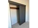 Contemporary closet with dark sliding doors, providing ample storage space at 2561 Red Rock Dr, Pahrump, NV 89048