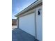 Attached two car garage featuring modern exterior sconces at 2561 Red Rock Dr, Pahrump, NV 89048