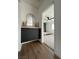 Hallway featuring gray cabinets with a marble countertop, leading to bedroom at 2561 Red Rock Dr, Pahrump, NV 89048