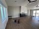 Bright living room with hardwood floors, modern fireplace, and sliding glass doors to the backyard at 2561 Red Rock Dr, Pahrump, NV 89048