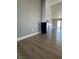 Living room showcasing the statement fireplace, gray textured walls and hardwood floors at 2561 Red Rock Dr, Pahrump, NV 89048