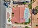 Overhead shot of a well-maintained house featuring a red tile roof and xeriscaped yard with artificial turf at 2829 Golf Links Dr, Las Vegas, NV 89134