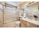 Cozy bathroom with tub, glass shower door, and a vessel sink at 2829 Golf Links Dr, Las Vegas, NV 89134