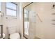 Bathroom featuring a glass-enclosed shower, toilet, and ample natural light at 2829 Golf Links Dr, Las Vegas, NV 89134