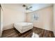 Bedroom with hardwood floors, ceiling fan, and a bright window at 2829 Golf Links Dr, Las Vegas, NV 89134