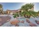 Attractive single-story home featuring desert landscaping, terracotta roof, and a spacious two-car garage at 2829 Golf Links Dr, Las Vegas, NV 89134