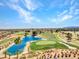 Scenic view of a lush golf course with a tranquil blue lake and mature palm trees under a clear sky at 2829 Golf Links Dr, Las Vegas, NV 89134