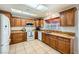 Traditional kitchen with wood cabinetry, granite counters, and stainless steel appliances at 2829 Golf Links Dr, Las Vegas, NV 89134