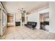 Living room with built-in shelving, fireplace, tile flooring and contemporary furnishings at 2829 Golf Links Dr, Las Vegas, NV 89134