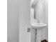 Pedestal sink and toilet featured in this light and bright bathroom at 2846 Cerulean Stars Ln # 1, Las Vegas, NV 89183
