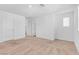 Large, vacant bedroom with a neutral carpet, ensuite bathroom, and natural light at 2846 Cerulean Stars Ln # 1, Las Vegas, NV 89183