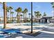 Resort style pool with palm trees, lounge chairs, picnic table and pool house at 2846 Cerulean Stars Ln # 1, Las Vegas, NV 89183