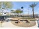 Community space with palm trees, landscaping and a bench at 2846 Cerulean Stars Ln # 1, Las Vegas, NV 89183