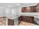 Stylish kitchen featuring granite countertops, stainless steel appliances, and rich wood cabinetry at 2846 Cerulean Stars Ln # 1, Las Vegas, NV 89183