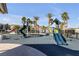 Community playground featuring slides and other equipment on a soft, blue surface at 2846 Cerulean Stars Ln # 1, Las Vegas, NV 89183