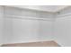 A walk-in closet features base molding and shelving for maximum storage at 2846 Cerulean Stars Ln # 1, Las Vegas, NV 89183