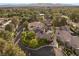 Stunning aerial view of the property with lush greenery, a sparkling pool, and a solar panel roof at 3004 Astoria Pines Cir, Las Vegas, NV 89107