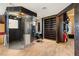 Stylish bathroom featuring a glass shower, salon chair, built-in shelving, and walk-in closet at 3004 Astoria Pines Cir, Las Vegas, NV 89107