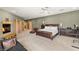 Large main bedroom with fireplace, seating area, desk, and a king-size bed at 3004 Astoria Pines Cir, Las Vegas, NV 89107