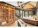 Sunlit main bedroom with custom shelving, vaulted ceilings, and sliding glass doors to outdoor living at 3004 Astoria Pines Cir, Las Vegas, NV 89107