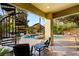 Backyard patio with lounge seating, a spiral staircase, and a view of the pool and garden at 3004 Astoria Pines Cir, Las Vegas, NV 89107