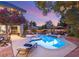 Backyard pool and patio with lounge chairs and lush tree surroundings, creating a tranquil retreat at 3004 Astoria Pines Cir, Las Vegas, NV 89107
