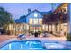 Inviting pool and spa area with outdoor seating and beautifully landscaped surroundings at 3004 Astoria Pines Cir, Las Vegas, NV 89107