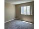 A sunlit bedroom with carpet and a bright window at 3151 Soaring Gulls Dr # 2147, Las Vegas, NV 89128