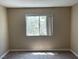 A carpeted bedroom with a window at 3151 Soaring Gulls Dr # 2147, Las Vegas, NV 89128