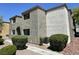 Condominium exterior featuring multi-level patios and stone-covered landscaping at 3151 Soaring Gulls Dr # 2147, Las Vegas, NV 89128