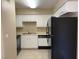 A kitchen with appliances and white cabinets at 3151 Soaring Gulls Dr # 2147, Las Vegas, NV 89128