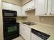 A kitchen with appliances and white cabinets at 3151 Soaring Gulls Dr # 2147, Las Vegas, NV 89128