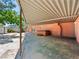 Spacious covered patio featuring a hot tub and backyard access at 3212 Silver Saddle St, Las Vegas, NV 89169