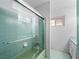 Bright bathroom featuring a tiled shower with glass door and updated fixtures at 3212 Silver Saddle St, Las Vegas, NV 89169