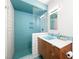 Stylish bathroom features a tiled shower with glass door, a sleek vanity, and modern fixtures at 3212 Silver Saddle St, Las Vegas, NV 89169