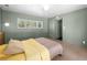 Spacious bedroom features a comfortable bed, large window with plantation shutters, and a neutral color scheme at 3212 Silver Saddle St, Las Vegas, NV 89169