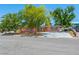 A single-story home with pink facade and a concrete driveway at 3212 Silver Saddle St, Las Vegas, NV 89169
