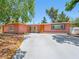 Charming single-story home with pink facade, front yard, and shade trees at 3212 Silver Saddle St, Las Vegas, NV 89169