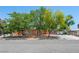 Charming single-story home with mature trees, a desert-landscaped yard, and a long driveway at 3212 Silver Saddle St, Las Vegas, NV 89169