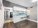 Modern kitchen with stainless steel appliances and breakfast bar at 3212 Silver Saddle St, Las Vegas, NV 89169