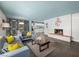 Open living room with slate floors and fireplace at 3212 Silver Saddle St, Las Vegas, NV 89169