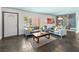 Inviting living room featuring slate flooring, large windows, and comfortable seating at 3212 Silver Saddle St, Las Vegas, NV 89169