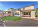 This backyard offers a putting green, covered patio, and low-maintenance gravel at 3213 Molinos Dr, Las Vegas, NV 89141