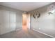 Neutral bedroom features a double sliding door closet and a flower wreath wall decoration at 3213 Molinos Dr, Las Vegas, NV 89141