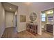 This entryway has an accent wall, hall table, and view into the powder room at 3213 Molinos Dr, Las Vegas, NV 89141