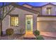 Inviting front exterior with desert landscaping, brick walkway and covered porch at 3213 Molinos Dr, Las Vegas, NV 89141