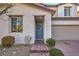 Inviting front exterior with desert landscaping, brick walkway and covered porch at 3213 Molinos Dr, Las Vegas, NV 89141