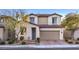 Charming two-story home with a well-manicured front yard and a two-car garage at 3213 Molinos Dr, Las Vegas, NV 89141