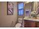 Compact half bathroom with a modern vanity and neutral wall color at 3213 Molinos Dr, Las Vegas, NV 89141